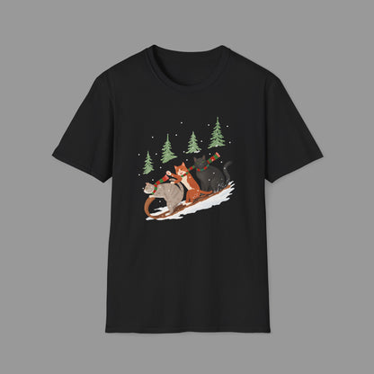 ZALOPA – Winter Cats Christmas T Shirt with Cozy Snowy Forest Scene Playful Sledding Cat Lover Graphic Tee for Holiday Season.